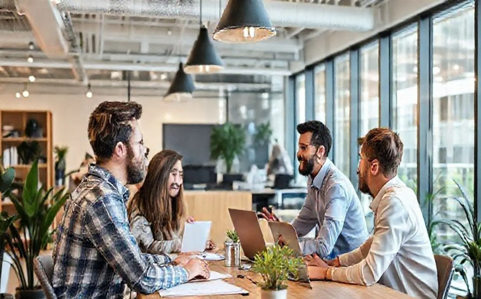 Young entrepreneurs meeting in modern office environment
